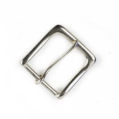 a metal buckle on a white background