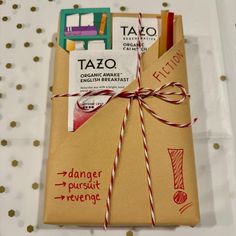 an envelope wrapped in brown paper and tied with twine