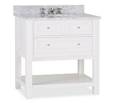 a white bathroom vanity with marble top and two faucets on the sink stand