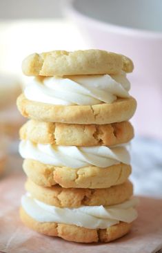 a stack of cookies with white icing on top