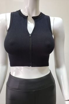 This Black Ribbed Short Sleeve Top with Front Zipper offers a sleek and stylish look. The ribbed fabric provides an extra layer of texture to the piece, while the front zipper makes it easy to slip on and off. Perfect for any occasion, it's sure to become a wardrobe staple. Fabric & fit: 92% Nylon 2% Spandex Model is wearing size Small. Black Stretch Top With Back Zipper, Black High Stretch Top With Zipper Closure, Trendy Solid Tops With Zipper Closure, Trendy Solid Color Top With Zipper Closure, Solid Stretch Top With Zipper Closure, Stretch Solid Color Top With Zipper Closure, Black Stretch Tops With Zip Fly, Ribbed Shorts, Black Rib