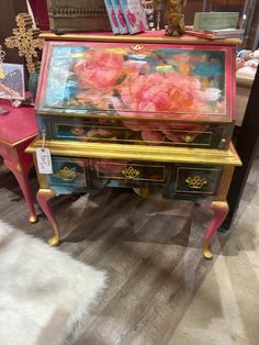 an antique desk with flowers painted on it