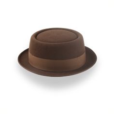 Description Materials Craftsmanship Hat Care Shipping Returns Product Description A Stylish Brown Men's Porkpie Hat Elevate your style with the Soul, a brown men's porkpie hat handcrafted from luxurious rabbit fur felt. Featuring a 3 1/2" telescope crown and a 1 3/4" raw-edge upturned brim, this hat offers a distinctive and sophisticated look. The 1 1/2" grosgrain ribbon hatband adds a touch of classic charm, while the viscose satin lining and genuine leather sweatband ensure all-day comfort and Porkpie Hat, Outdoor Hut, Hats For Big Heads, The Raid, Homburg, Crown Design, Hat Band, Rabbit Fur, Custom Hats