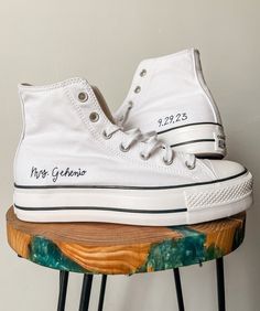 A timeless keepsake to wear to your bridal shower, on the wedding and beyond! These would also make the perfect gift for that super cool bride you know!  - Custom Chuck Taylor All Star Lift Platform - Black DMC Floss used to embroider the name and date HOW IT WORKS: Leave the name as you want it written in the personalization box along with the date of the wedding. For example this would look like "Mrs. Smith , 9-28-19". I will order the converse to be embroidered on.  DETAILS: - Final product is a pair of hand-embroidered white canvas Chuck Taylor All Star Lift Platform -  Writing of the name and date is done in my own personal style - Last name is embroidered on the outside of the right-foot shoe - Date is embroidered on the outside of the left-foot shoe  THE PROCESS: - Purchase the list Wedding Converse Bride, Converse Bride, Personalized Converse, Converse Wedding, Bridal Converse, White Rehearsal Dinner Dress, Dress With Converse, Cool Bride