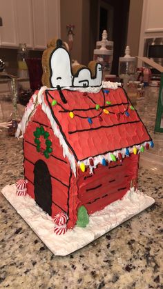 a gingerbread house decorated with icing and decorations