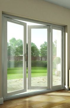 an empty living room with sliding glass doors