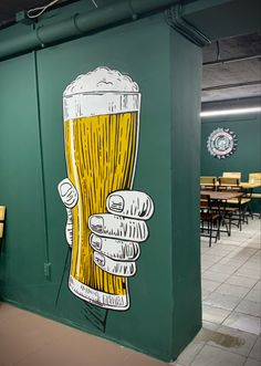 there is a mural on the wall of a restaurant with a glass of beer in it