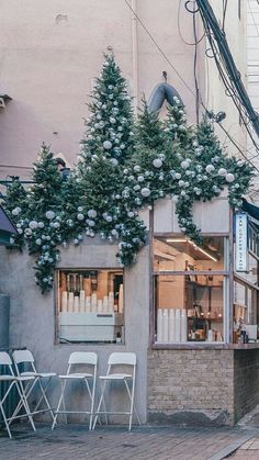 an outside view of a restaurant with tables and chairs