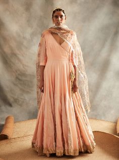 This set features a peach chanderi gherdaar double-layered angarakha with a silver woven zari godet insert with one of the kind hand painted and hand embroidered madhubani organza dupatta embellish... Peach Anarkali, Embroidered Anarkali, Anarkali Gown, Organza Dupatta, Lehenga Designs, Indian Fashion Designers, Anarkali Dress, Pernia Pop Up Shop, Indian Ethnic Wear