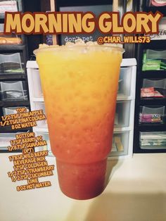 an orange and yellow drink sitting on top of a counter