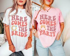 Having a bachelorette party for the bride to be? Then these fun bachelorette shirts will be perfect for your entire bach group! Each Shirt is professionally designed, printed, and then packaged with care by our awesome design and production team. Color Disclaimer Actual colors may vary from our listing photo and the final product. We cannot guarantee that the color you see accurately illustrates the true identical color of the product. UNISEX SIZING - PLEASE REFER TO SIZE CHART UNISEX 𝐒𝐡𝐢𝐫𝐭 𝐃𝐞𝐭𝐚𝐢𝐥𝐬: * 100% Cotton * Unisex sizing * Retail fit * Pre-shrunk Please see images for sizing details. Please measure current shirts that fit well and match up to our size charts for a better idea on sizing for you. Keep Shopping our entire store:  https://www.etsy.com/shop/SymbolicImports Fitted Pink T-shirt For Hen Party, Pink Fitted T-shirt For Hen Party, Pink Tops For Bachelorette Party, Pink Short Sleeve Tops For Hen Party, Short Sleeve Tops For Bridesmaids, Pink Short Sleeve Shirt For Bachelorette Party, Ultimate Bachelorette Party, The Party, Group Party