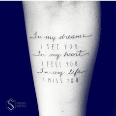 a person with a tattoo on their arm saying i am my dreams is see you in my heart