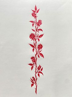 a drawing of red flowers on white paper