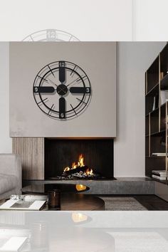 a living room with a large clock mounted to the wall above it's fireplace