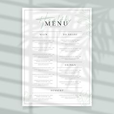 a menu with palm leaves on it