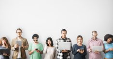 a group of people standing in front of a white wall with the words, the rise of the network of teams