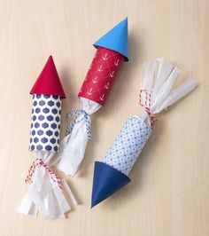 three paper cones are sitting on the table