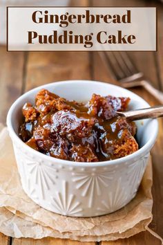 a white bowl filled with bread pudding on top of a wooden table