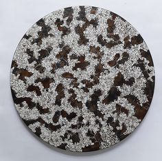 a brown and white plate sitting on top of a table