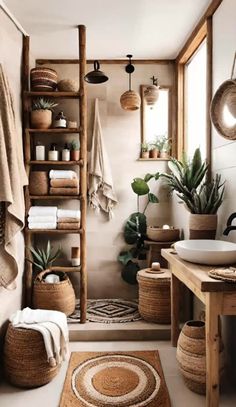 the bathroom is decorated in neutral colors and natural materials, including towels, rugs and baskets