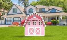 a pink barn with the words our cowgirl is on it in front of a house