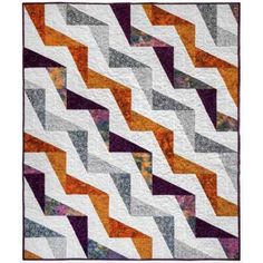 an orange and grey quilt with white, black, and purple stripes on it's edges