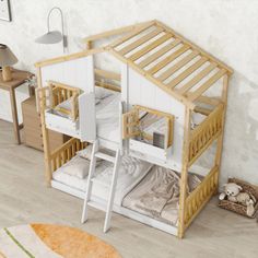 there is a bunk bed with a ladder on the bottom and a loft above it