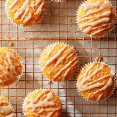 cupcakes with icing on a cooling rack