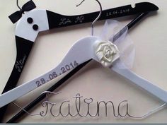 the bride and groom's personalized wedding hangers are made out of scissors