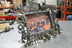 a frame made out of gears sitting on top of a table