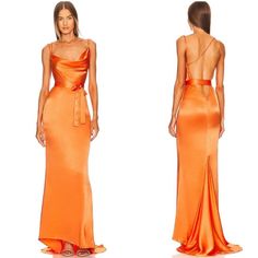 a woman in an orange dress with one back cut out and the other side open