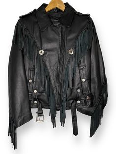 Vintage 1990's tassel fringe black leather biker jacket. Deerskin Trading Post tag size 10. Normal wear, no major flaws. Please see all photos and contact us with any questions.    Actual measurements: 20" pit to pit 25" top to bottom Check out our "Accessories" section for vintage patches, pins, and more to customize your look.   Instagram: @IdleHandsVintage Black Leather Biker Jacket, Leather Moto, Vintage Patches, Leather Moto Jacket, Deer Skin, Leather Biker Jacket, Tassel Fringe, Moto Jacket, Biker Jacket