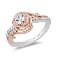 a white and rose gold ring with diamonds on the band, set in two tone gold