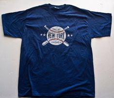 New York GAME DAY BASEBALL T Shirt (Graphic Tee) XLarge Blue Cotton Mens | eBay Blue Graphic Print Baseball Jersey For Baseball Season, Casual Blue Baseball Jersey For Fans, Blue Baseball Jersey With Graphic Print, Blue Baseball Jersey With Graphic Print For Streetwear, Blue Graphic Print Baseball Jersey, Casual Blue Baseball Jersey With Graphic Print, Blue Cotton Baseball Jersey With Graphic Print, Blue Graphic Print Cotton Baseball Jersey, Blue Team Logo T-shirt For Baseball Season