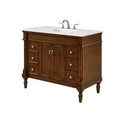 a bathroom vanity with two faucets on the top and one sink below it