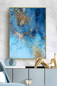 a blue and gold abstract painting in a living room