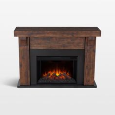 an image of a fireplace with fire burning in it's side and the top panel open