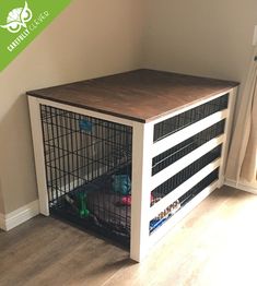 a dog crate sitting in the corner of a room