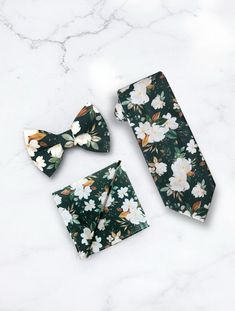 Our green emerald floral neckties and bow ties are the PERFECT choice for a wedding, mens floral ties for groomsmen or any other special occasion! //SHIPPING// We ship via USPS. **FIRST CLASS MAIL (default) takes 2-5 business days to arrive AFTER your package is shipped. **PRIORITY MAIL takes 1-3 business days to arrive AFTER the items are shipped. //Important// Business Days are Monday-Friday //International Orders// Please understand that International Orders take 4-6 weeks and customs need to be factored in here //Very Important// The Bold Bow Tie will not be held responsible for postal service errors. We wish we had that kind of control, but unfortunately we do not. Thank you for understanding. **Please order a swatch to make sure the color is perfect before ordering a large order. We Mens Floral Ties, Mens Floral Tie, Green Bow Tie, Bowtie And Suspenders, Necktie Set, Orange Bows