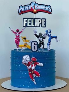 a birthday cake with the power rangers on top