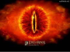 the lord of the rings logo in front of an orange fireball with flames around it