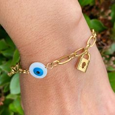 Lock, Key, Evil Eye Stainless Steel Bracelet Is An Elegant And Classic Bracelet That Is Considered An Amulet That Can Keep Bad Vibes Away From You And Bring You Luck, Wealth, Protection And Prosperity. Lenght 7 1/2” Approx Extender 1 1/2” Water Resistant Tarnish Resistente Hypoallergenic Lead And Nickel Free Highly Durable Due To Its Inherent Resistance To Corrosion And Scratches. This Makes It Excellent For Everyday Use. Disclaimer:Product Color May Slightly Vary Due To Photographic La Pulsera Gold Charm Bracelet With Evil Eye, Metal Evil Eye Bracelet For Gift, Evil Eye Metal Bracelet Gift, Bracelet Lock, Peach Bracelet, Customize Jewelry, Geometric Bangle, Owl Bracelet, Vintage Bangle Bracelets