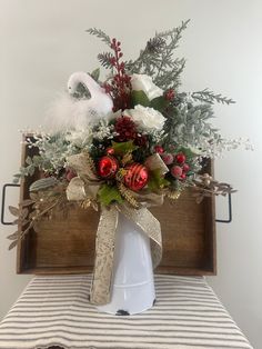 Thank you for choosing 'Made in the US' items!  Thank you for shopping ADFCreations! Elevate your festive decor with this enchanting Swan-Themed Winter/Christmas Decoration, a truly graceful centerpiece that exudes the serenity and pristine beauty of a winter wonderland. Artfully arranged in a white metal pitcher, this piece brings a touch of farmhouse elegance to any setting, making it a perfect complement to your holiday celebrations. Delicate and Charming Design: Standing at an impressive 26 Winter Swan, Pitcher Centerpiece, Metal Pitcher, Winter Arrangements, Centerpiece Christmas, Beautiful Swan, Silk Floral Arrangements, Grace To You, Thoughtful Christmas Gifts