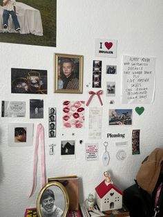 a wall covered with pictures and magnets on it