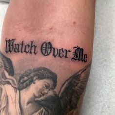 a tattoo with the words watch over me and an angel holding a baby in his arms