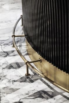 a close up of a metal and marble table