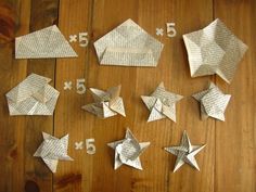 some paper stars and numbers on a wooden table