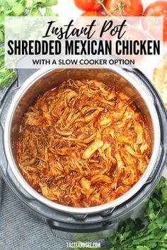 instant pot shredded mexican chicken in a slow cooker with tomatoes and parsley on the side