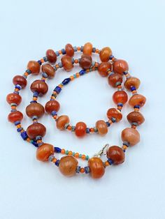 The Beautiful Old Ancient Carnelian Beads Necklace Some Lapis Beads Are Used As Spacers in the Necklace The Age Of this Bead are More Than 2000 Years Old This Carnelian Beads Was Used As Amulet ,Prayer Beads ,Trade and Jewelry in Ancient Himalayan Regions Conditions Of Beads Are Clearly Shown in the Pictures Price Is Negotiable So Please Do not Hesitate To Make an Offer Best Gift for the people who collect Ancient Beads and study Ancient History Fast and Free Shipping Enjoy Beads Orange Beaded Amulet Jewelry, Traditional Orange Beaded Bracelets With Polished Beads, Traditional Orange Beaded Necklace With Gemstones, Bohemian Orange Gemstone Beads And Cabochons, Orange Beaded Amulet Necklace, Traditional Orange Gemstone Beaded Necklace, Artisan Orange Beaded Necklaces, Artisan Orange Round Beaded Necklaces, Orange Healing Jewelry With Colorful Beads