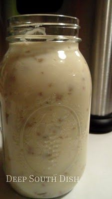 a jar filled with liquid sitting on top of a table